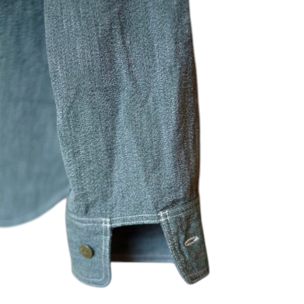 MILWORKS Atlas work shirt cuff in sage green 6.5 oz. Japanese selvedge salt and pepper covert chambray fabric.