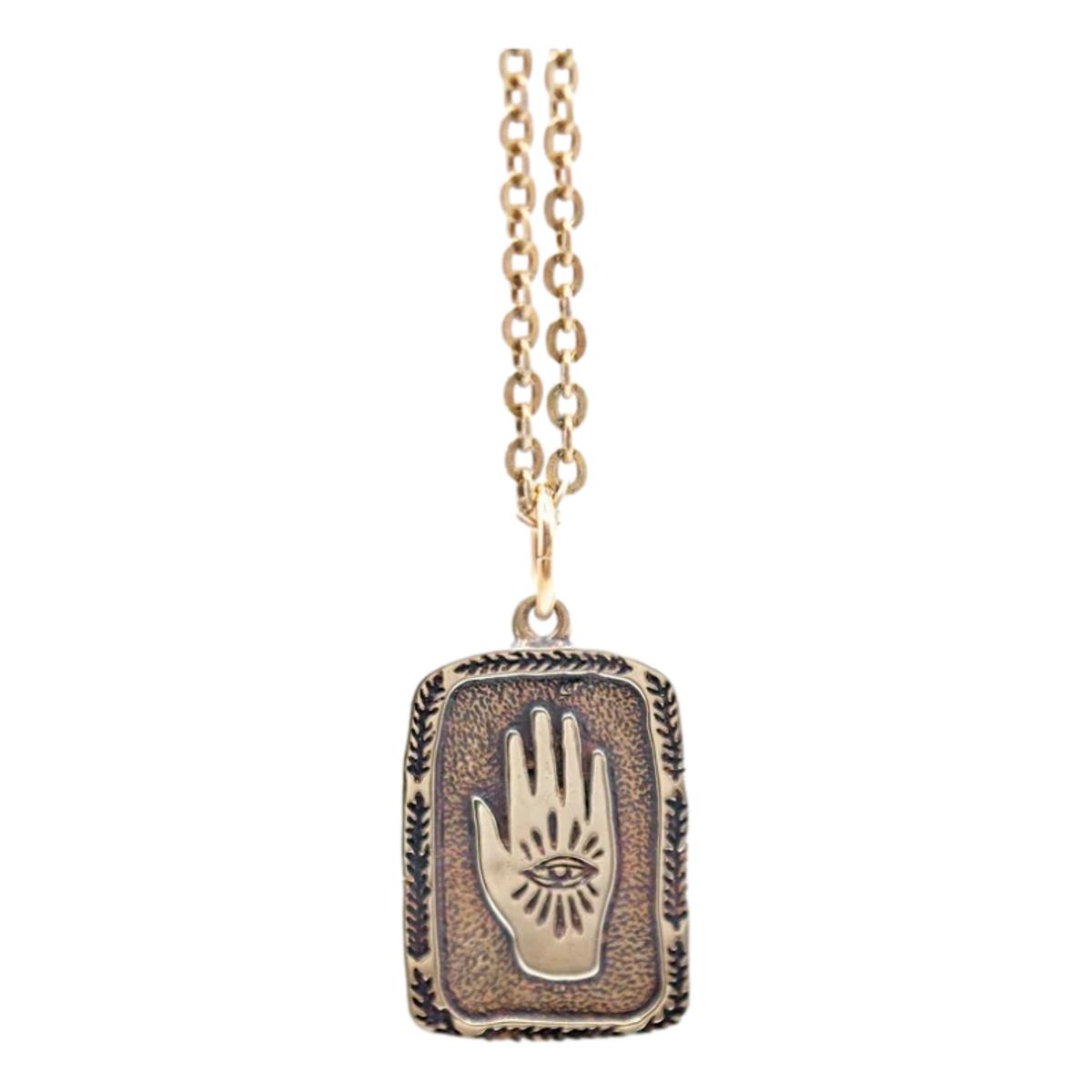 Eye in Hand Necklace Brass