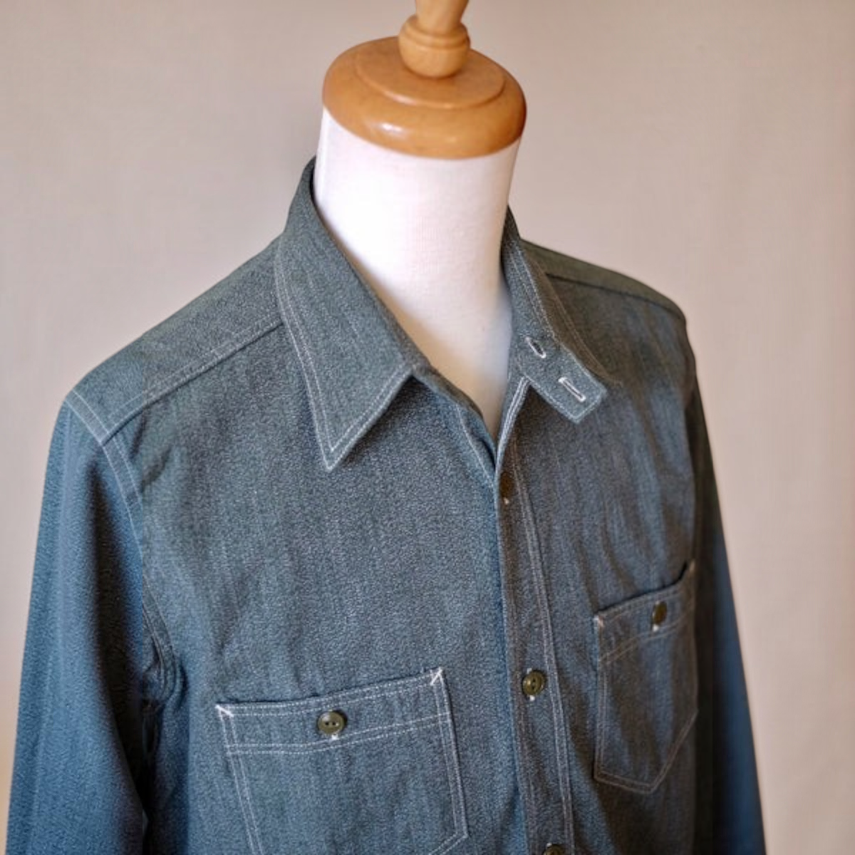 MILWORKS Atlas sage green 6.5 oz. selvedge salt and pepper chambray work shirt with chinstrap collar detail.