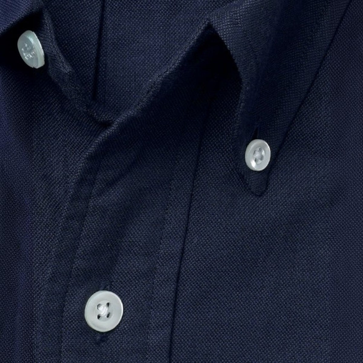 Kamakura navy blue cotton oxford button-down shirt featuring a classic collar and cream-colored shell buttons.