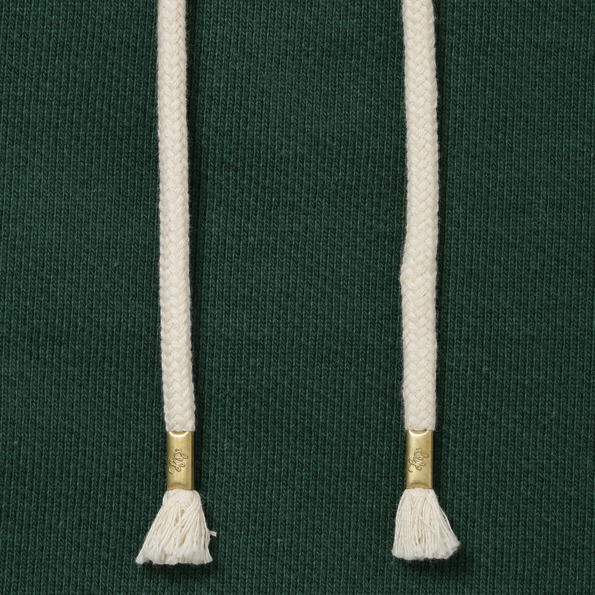 MILWORKS racing green double heavyweight French terry hoodie featuring cream drawstring cords with gold metal aglets.