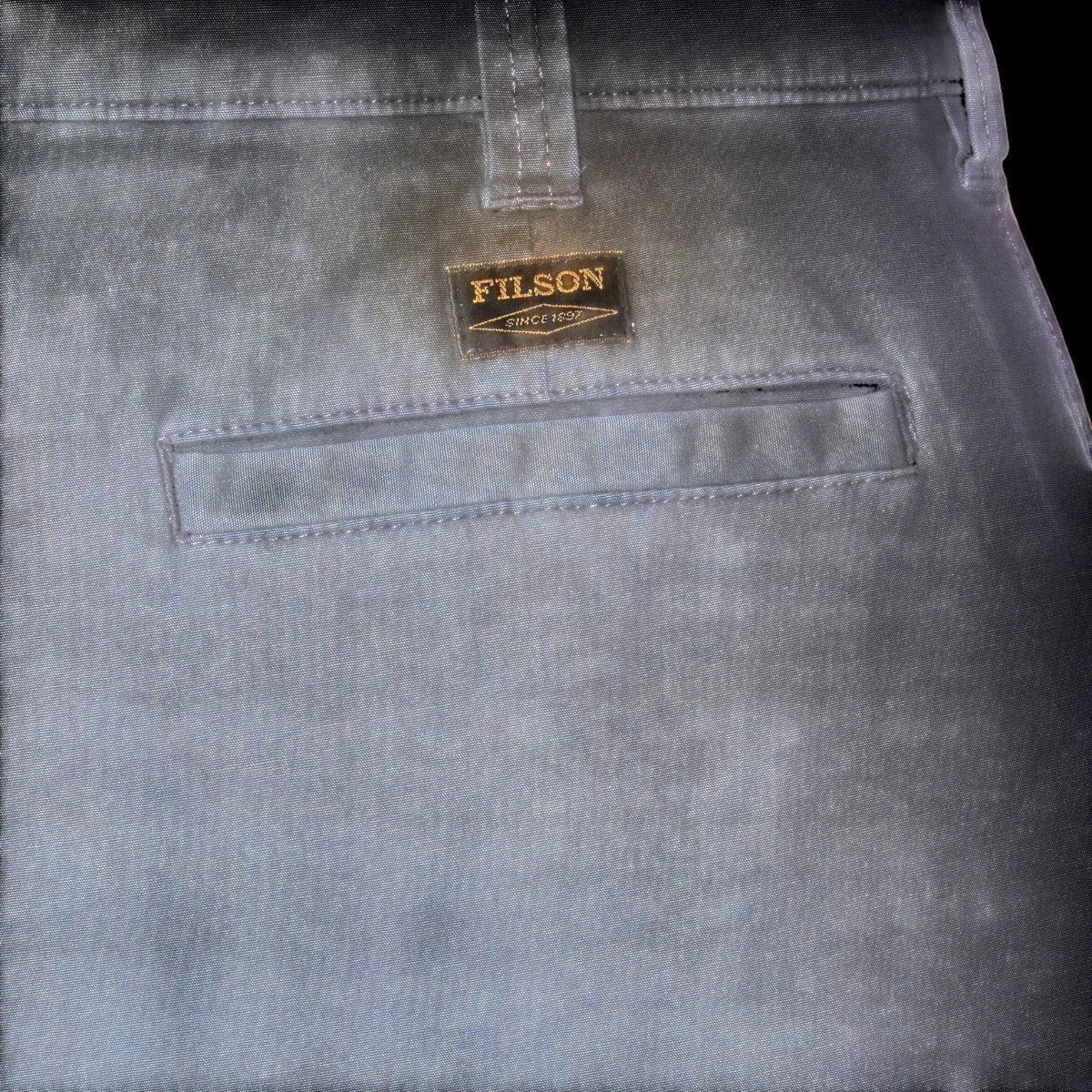 MILWORK Granite Mountain 6" shorts in ink blue, made from a cotton-blend fabric with a Filson logo patch and welted rear pocket.