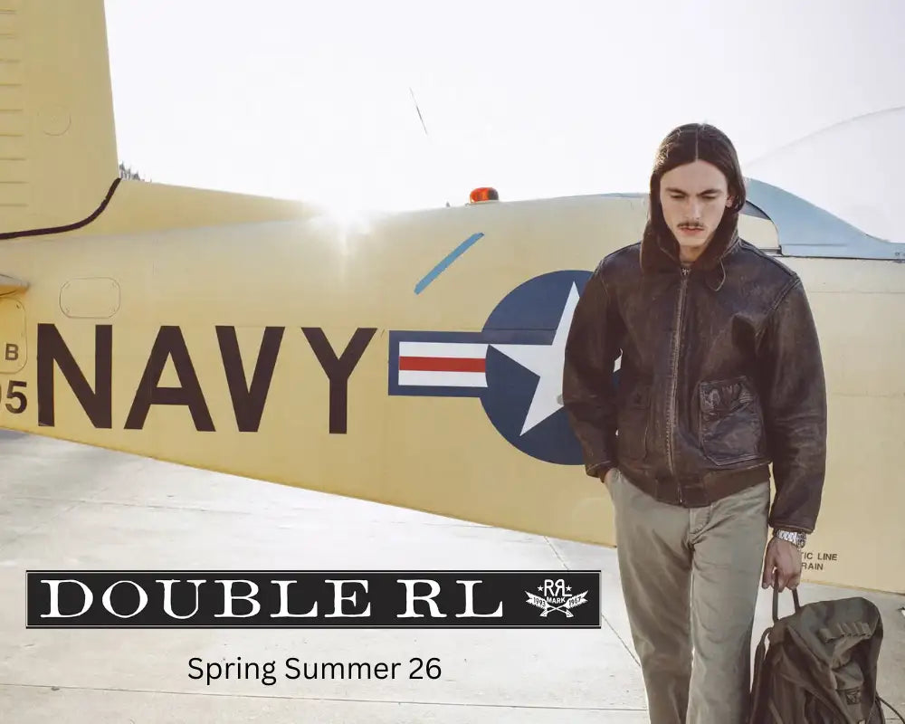 Dark brown leather bomber jacket with a classic aviator design and visible stitching.