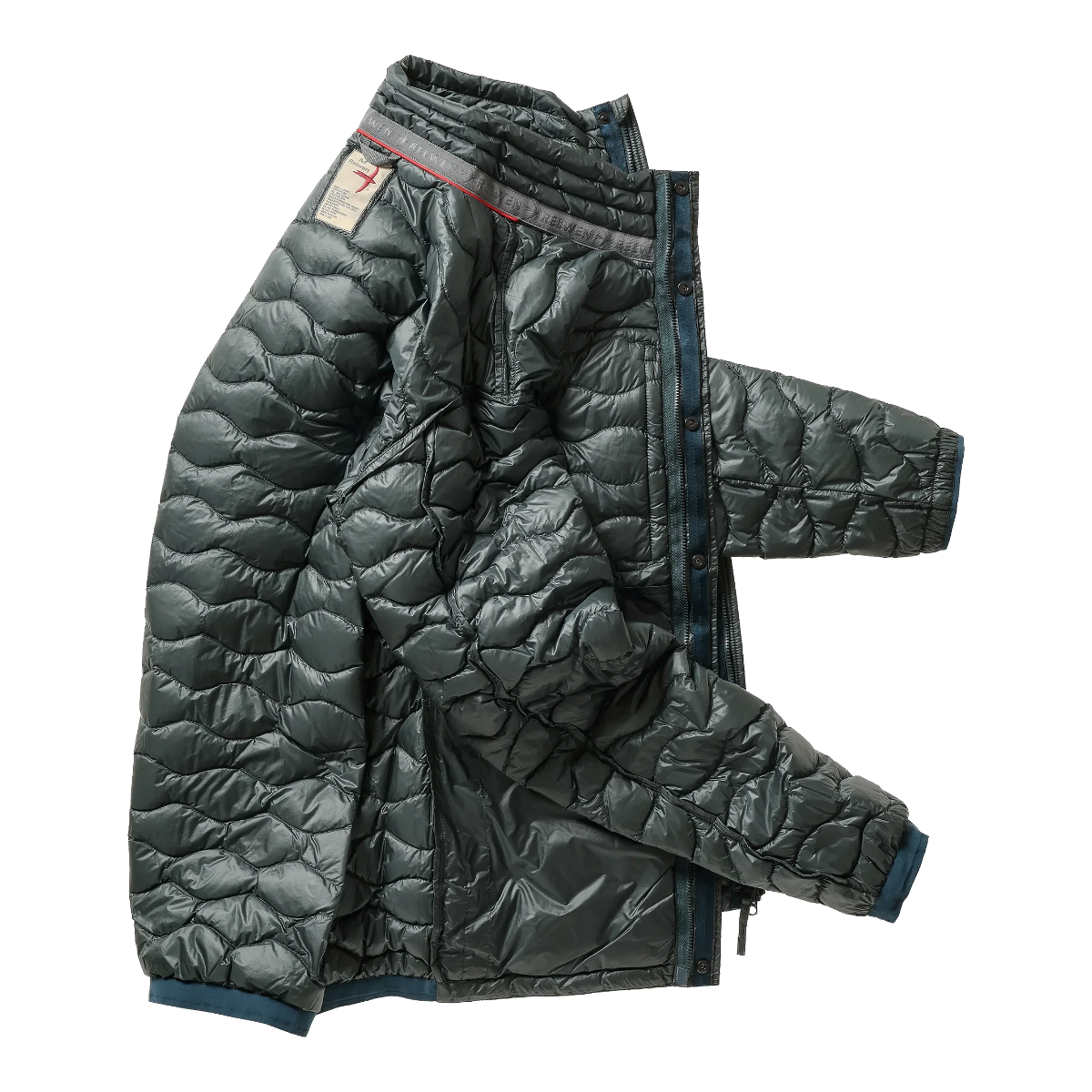 Milworks Wave-Quilt down jacket in black forest green with wave-pattern stitching and snap-button placket.