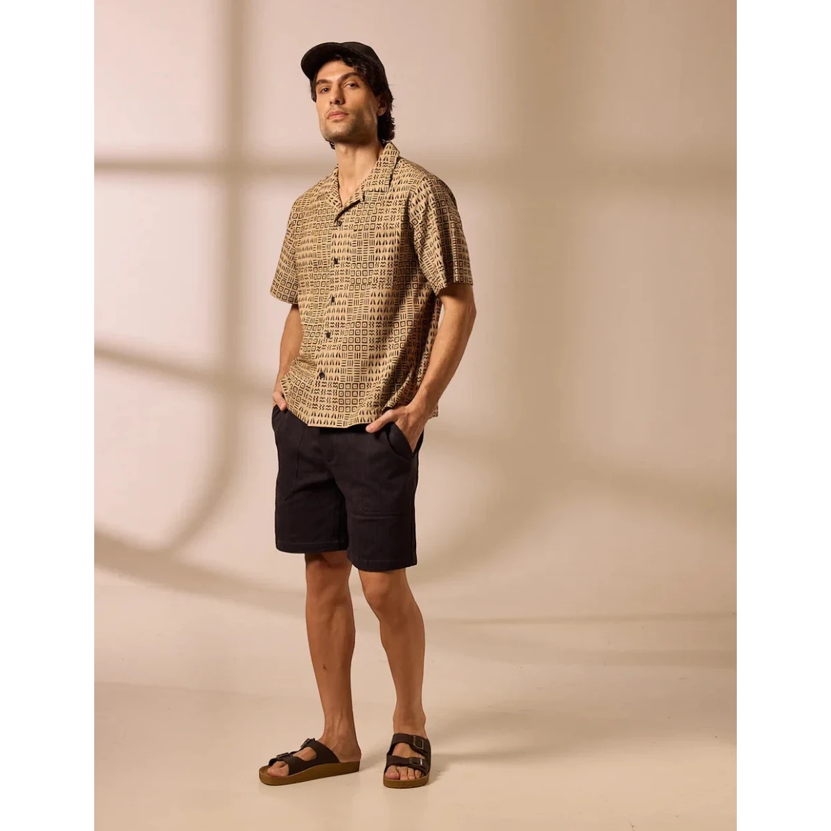 MILWORK Khushi Camp Shirt in black with tile block print on 100% cotton. Relaxed fit, short sleeves, spread collar.