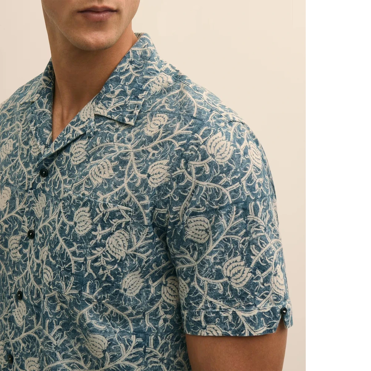 MILWORK blue and white floral print 100% cotton short sleeve camp collar shirt worn by a man.