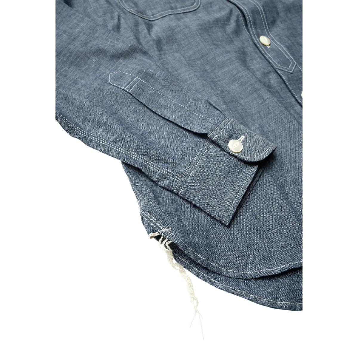 MILWORK blue selvedge chambray work shirt with triple-needle stitching and shell buttons.