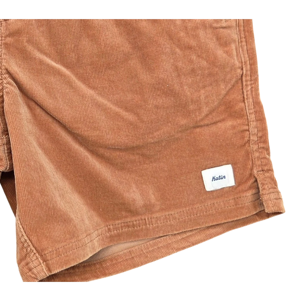 MILWORK Cord Local Short Brush in rust corduroy with a touch of stretch. Features welt pockets and a 17" outseam.
