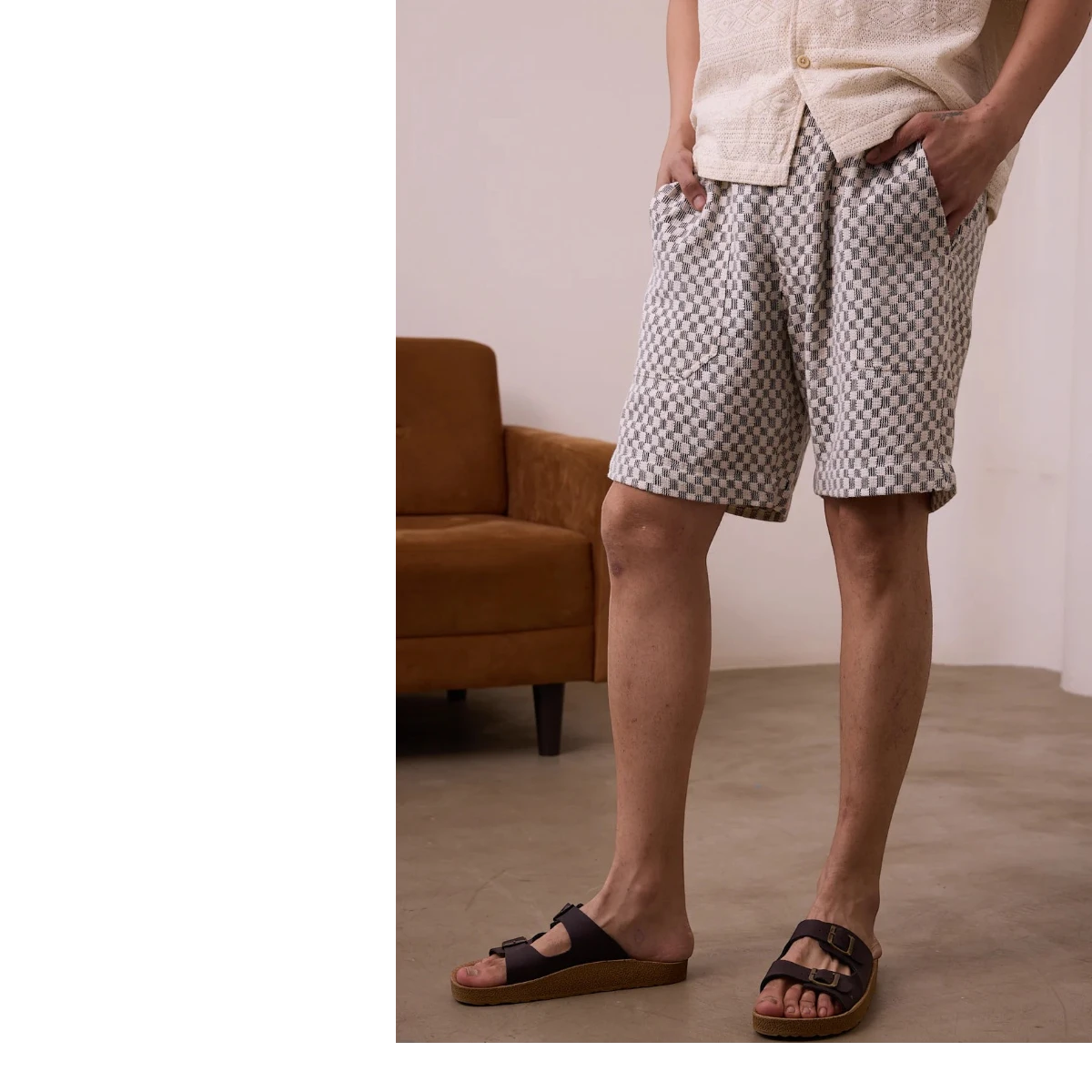 MILWORK Dipak black and white checkered crochet shorts with elastic waistband and pockets, made from handwoven cotton.
