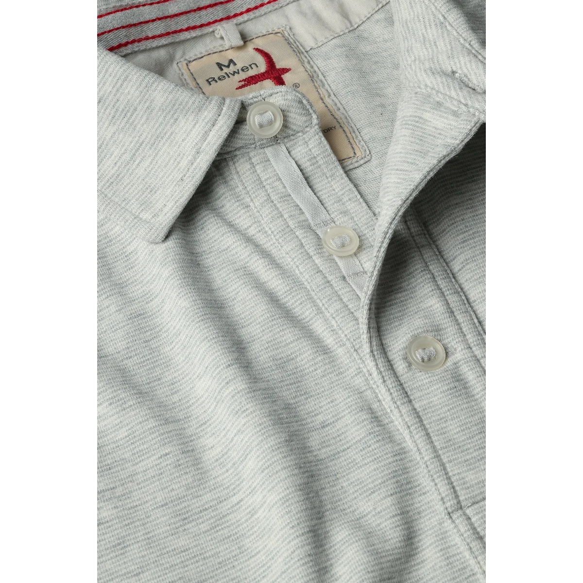 MILWORK Relwen Fineline Jersey Polo in stone white, featuring a textured knit fabric, button collar, and signature logo tag.