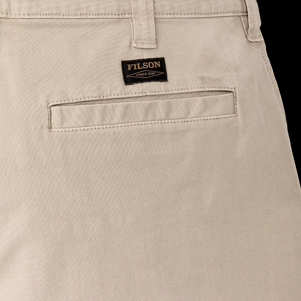 MILWORK Granite Mountain 6" shorts in buck tan cotton blend with welted rear pocket and Filson logo patch.