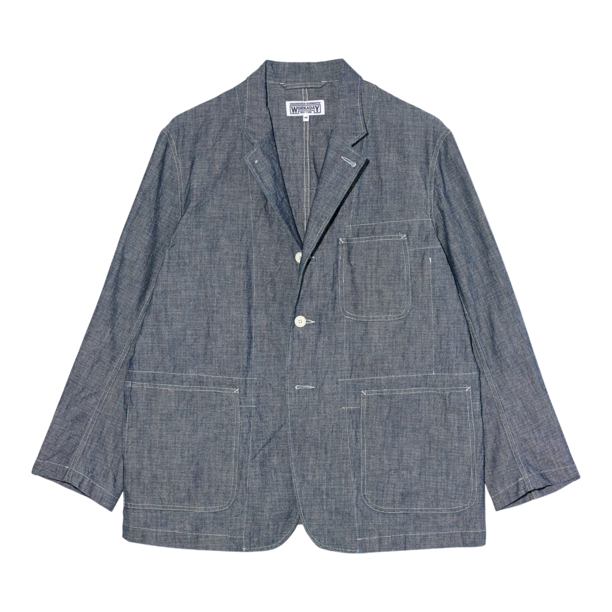 MILWORK Indigo 10oz Sea Canvas MED Blazer, a 100% cotton workwear jacket with white contrast stitching and three front pockets.