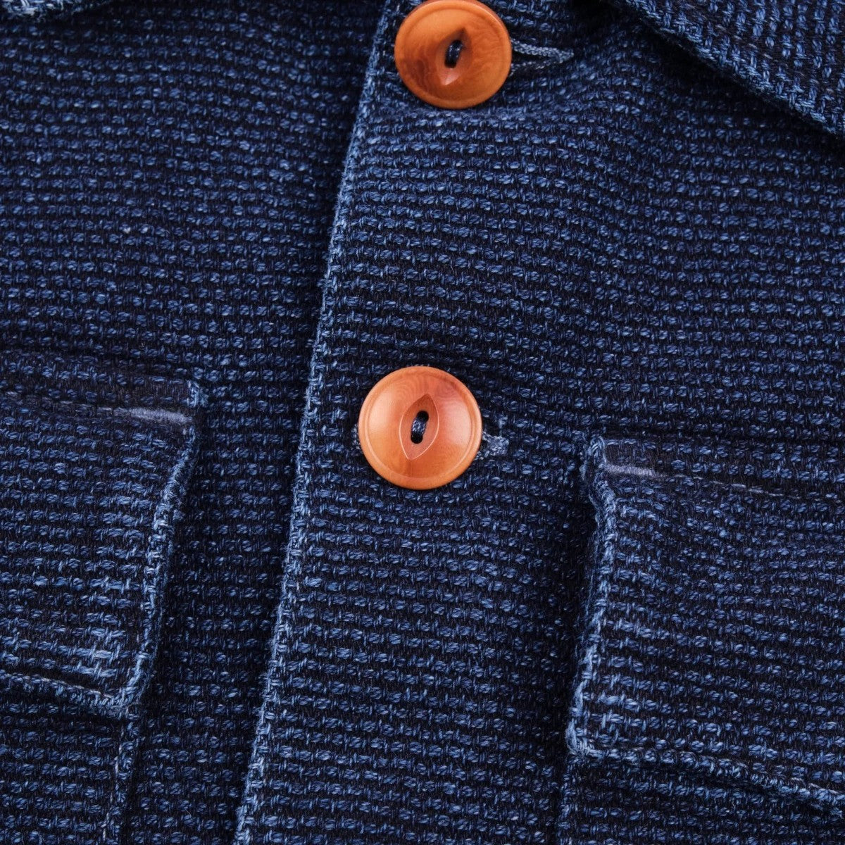 MILWORK Indigo Sashiko Japanese cotton shirt with two chest pockets and corozo buttons.