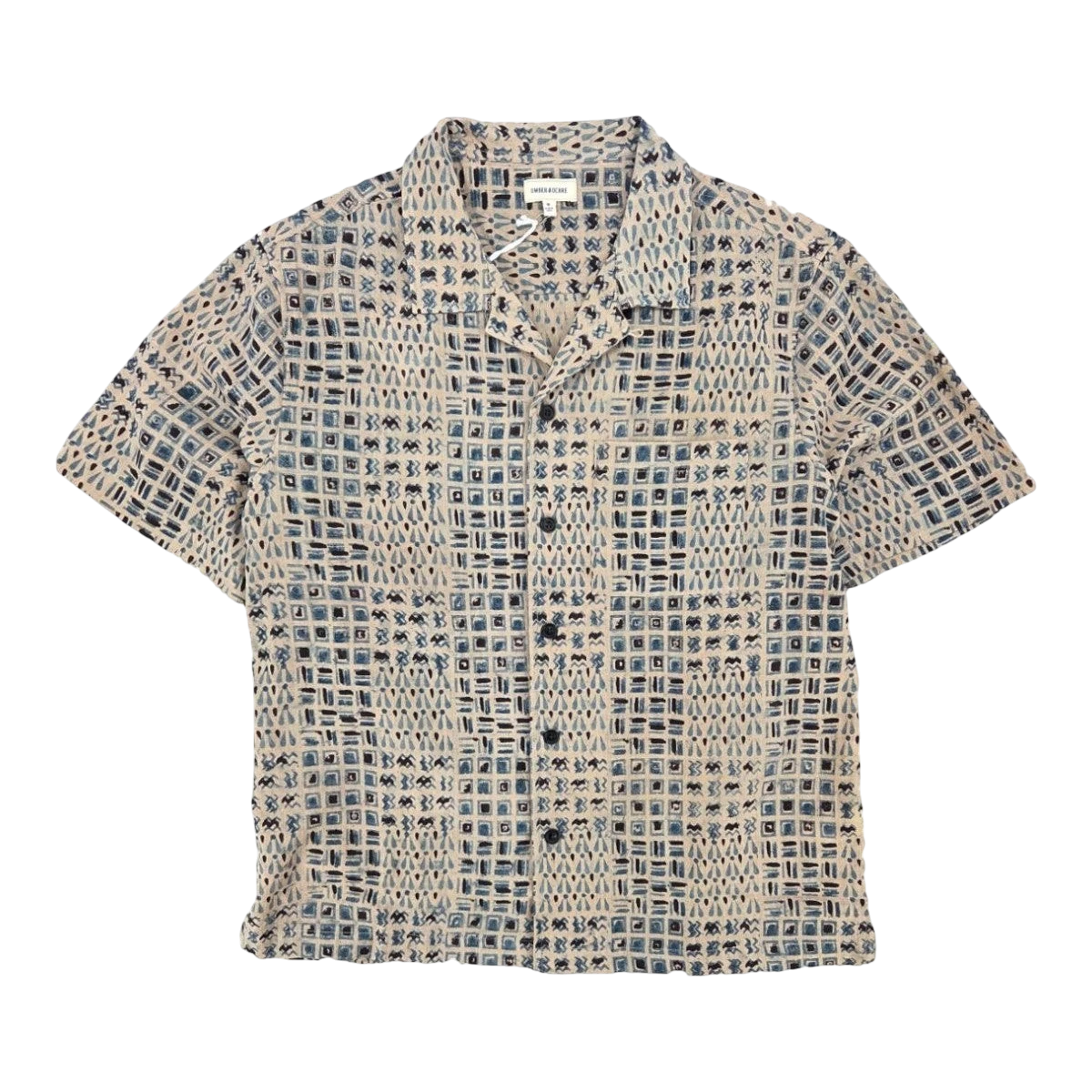 MILWORK Khushi Camp Shirt in indigo blue and beige with a tile block print. Features short sleeves, spread collar, and chest pocket.