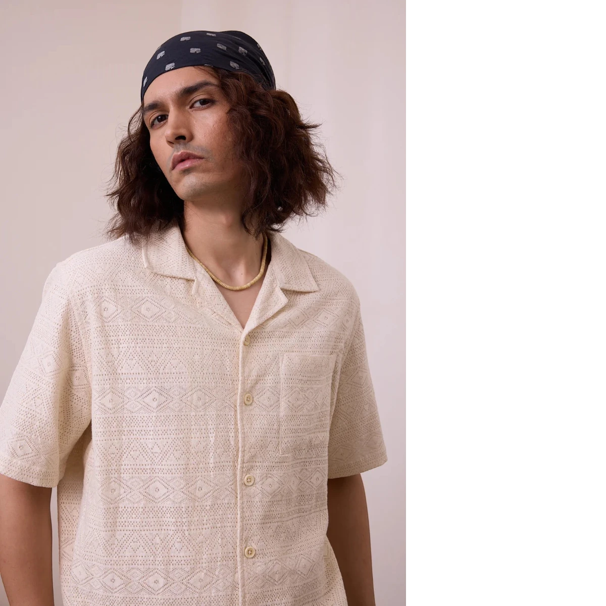 MILWORK Khushi Camp Shirt in Lace Aztec. Natural knit cotton with an all-over geometric pattern, camp collar, and single chest pocket. Relaxed fit, button closure.