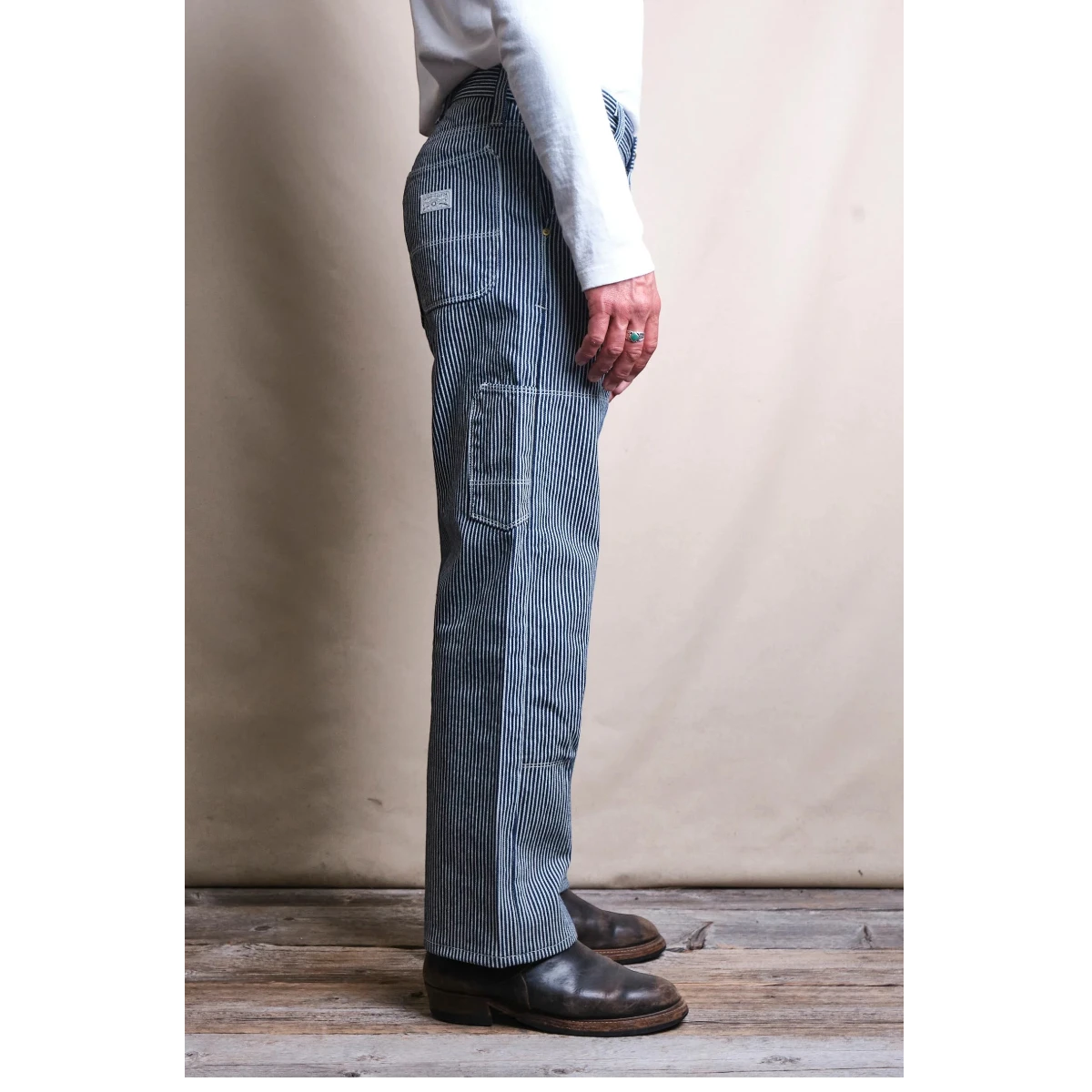 MILWORK Ortega hickory stripe cotton work pants with double knees and straight leg silhouette.