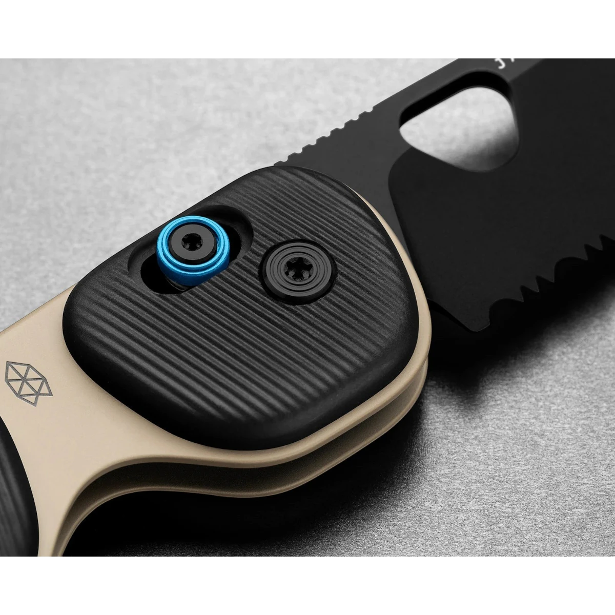 MILWORK Redstone coyote tan and black folding knife with serrated blade and blue thumb stud.