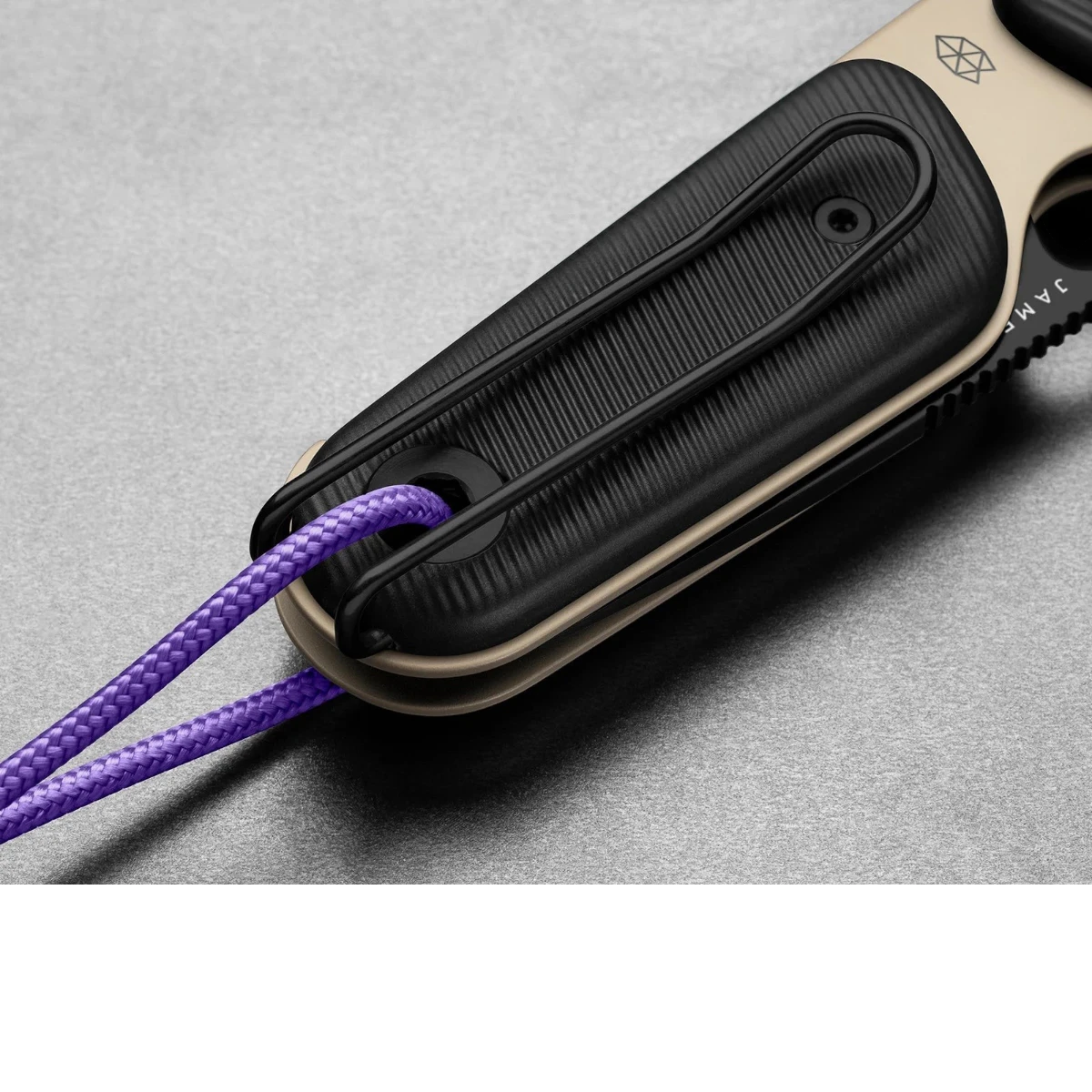 MILWORK The Redstone coyote tan and black folding knife with purple lanyard and wire clip.