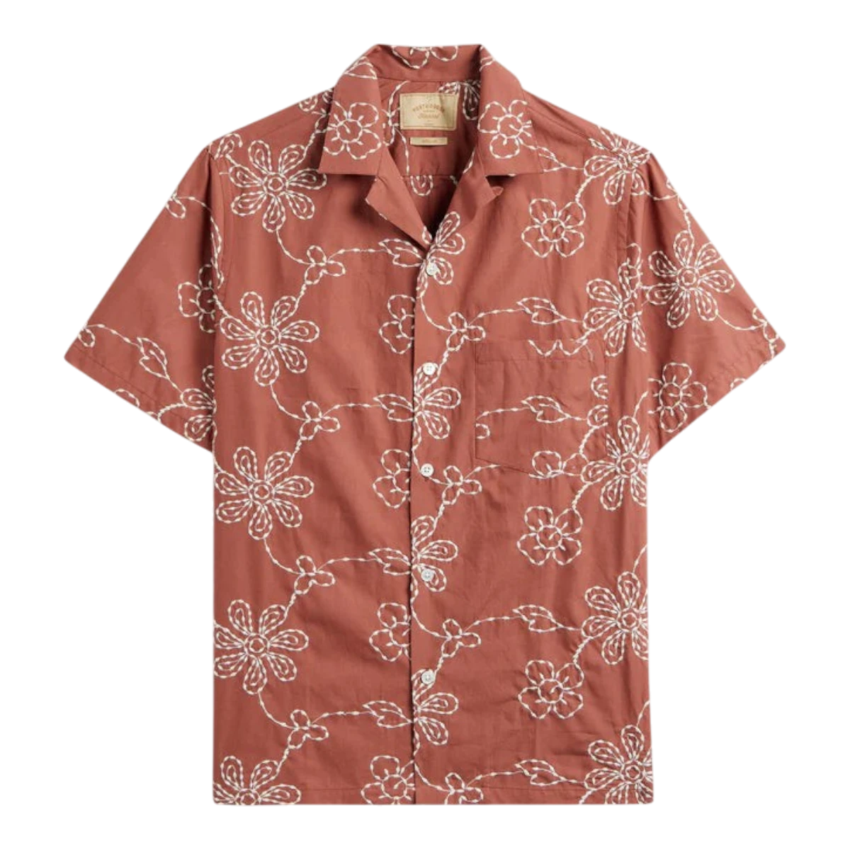 MILWORK Compota Shirt in rust orange cotton blend with white floral embroidery and mother of pearl buttons. Short sleeves, camp collar.