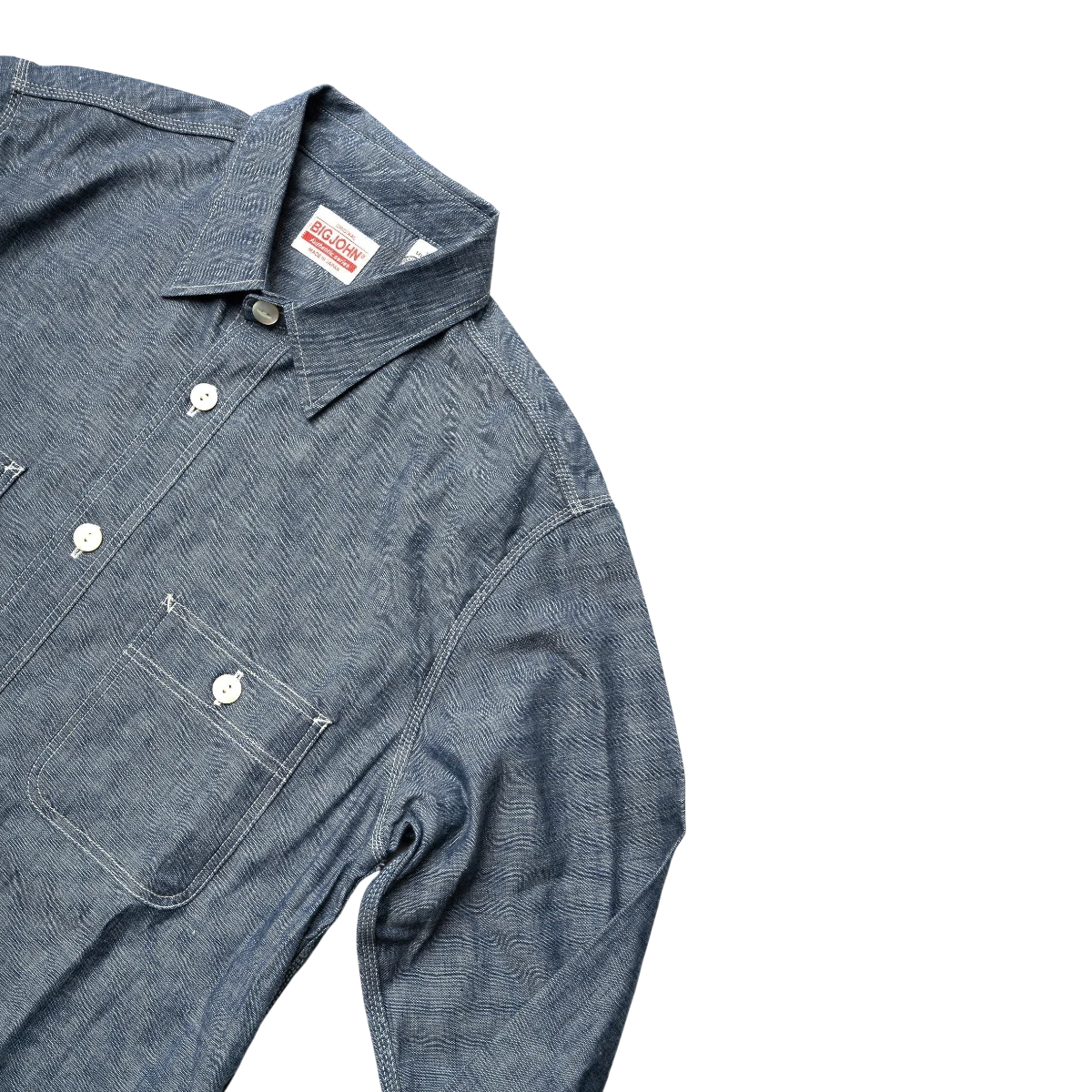 MILWORK Selvedge Chambray Work Shirt in indigo blue, featuring a textured weave, triple-needle stitching, and natural shell buttons.