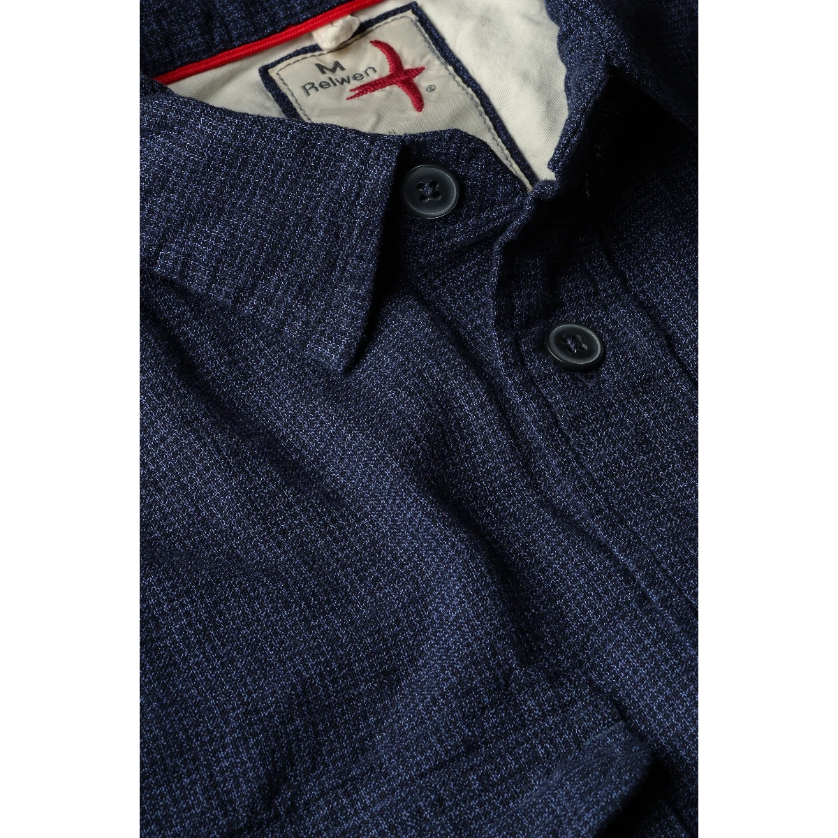 MILWORK Windsail workshirt in dark indigo, featuring a textured micro-ripstop fabric, button-down collar, and dark buttons.