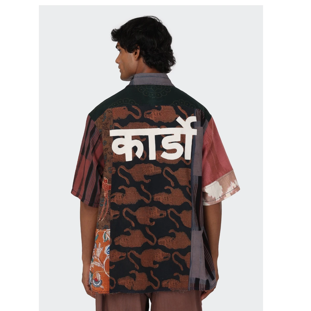 MILWORK Yuto 12 panel patchwork shirt with oversized fit, raw edge details, and white text on the back. Made from 100% cotton.