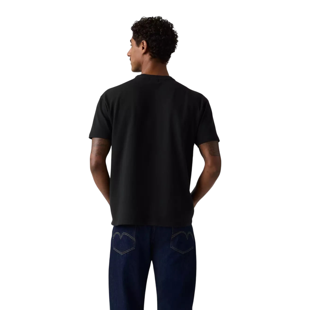 Back view of a man wearing a MILWORKS 1960's Casuals Tee in jet black heavyweight cotton with a classic crew neck.