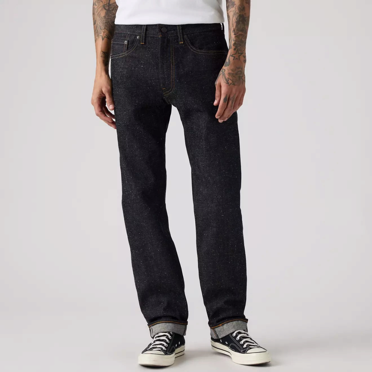 MILWORKS Levi's 505 Neppy Rigid Selvedge dark wash straight leg jeans with a zip fly on a model