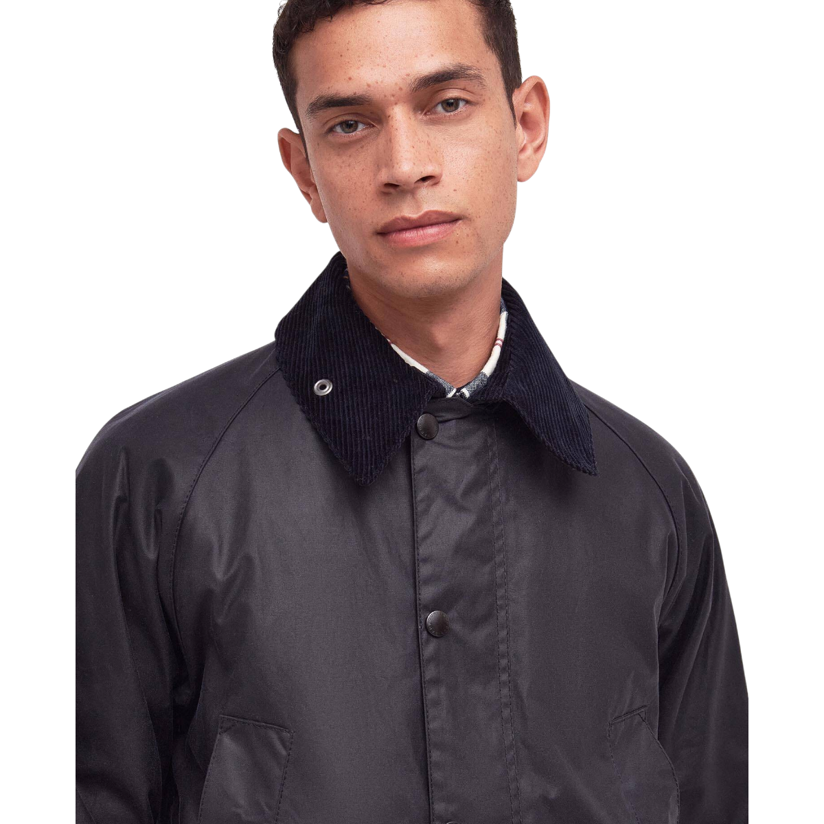 MILWORKS model wearing a navy Barbour Bedale waxed cotton jacket with a traditional corduroy collar.
