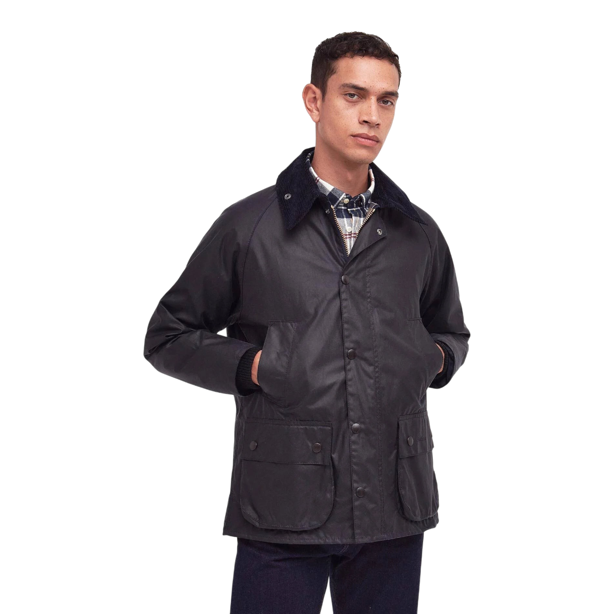 MILWORKS model wearing a navy Barbour Bedale waxed cotton jacket with a corduroy collar and bellows pockets.