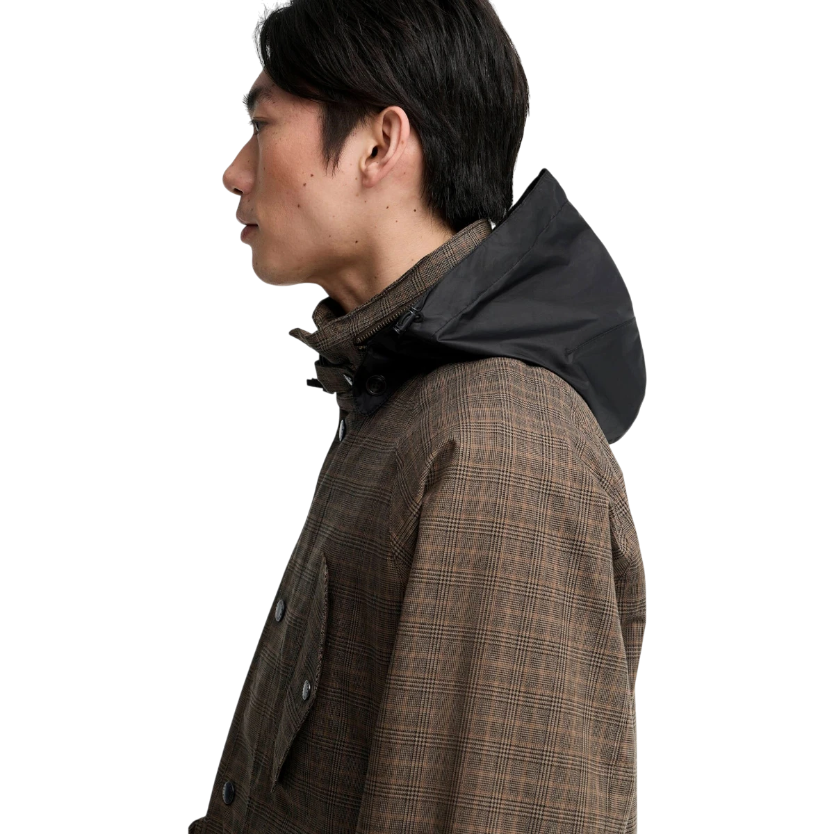 MILWORKS Barbour Transport Ursula waterproof jacket in dark stone check with a black stow-away hood, side profile view.