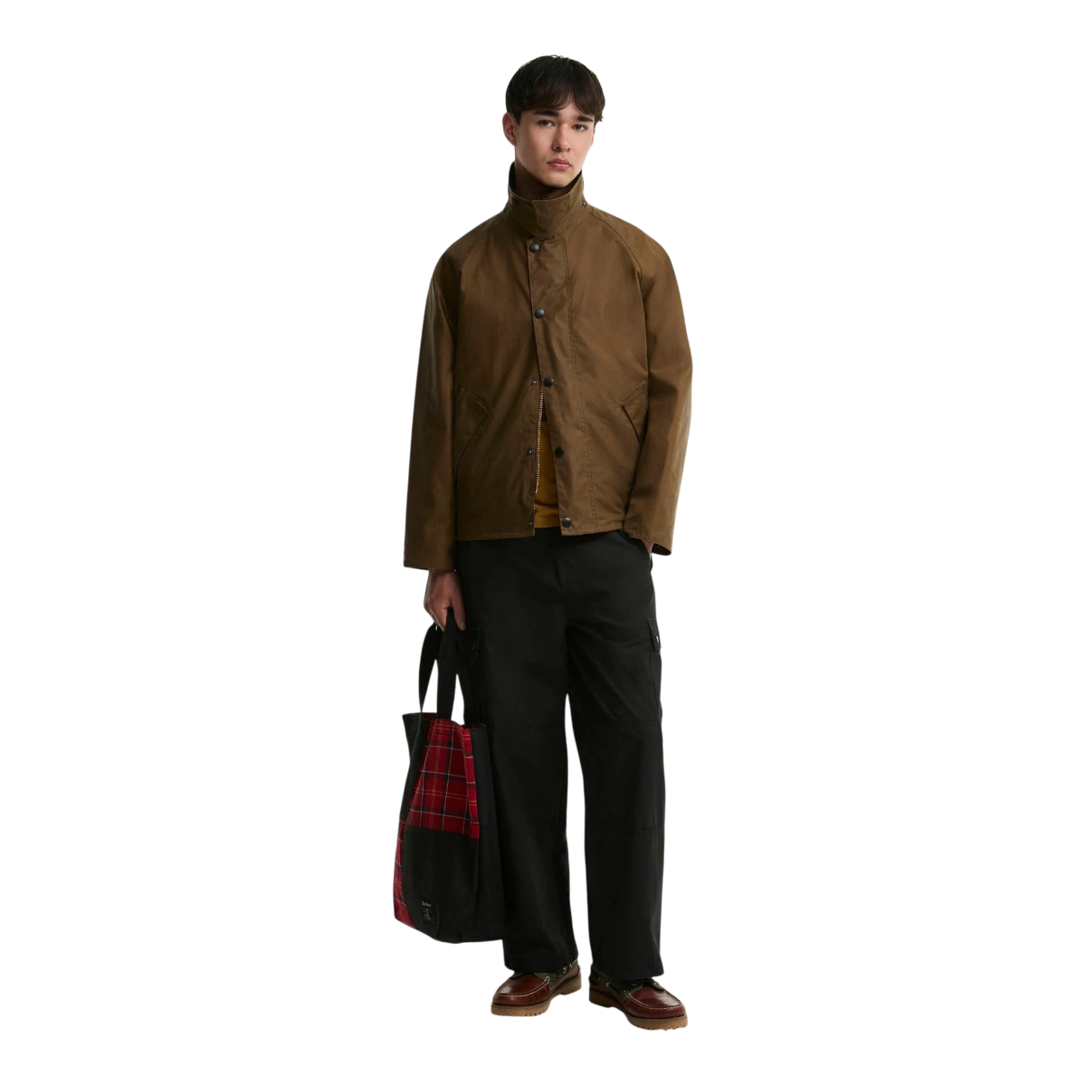 A model wearing a MILWORKS Barbour Transport sand-coloured waxed cotton jacket with a cord collar and boxy fit.