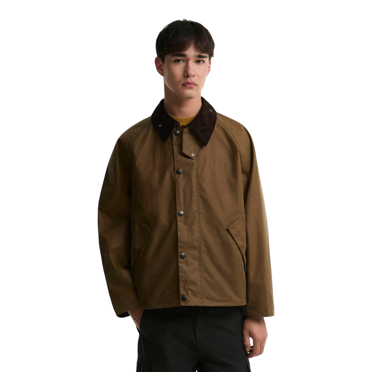 A model wearing a MILWORKS Barbour Transport sand-coloured waxed cotton jacket with a brown corduroy collar.
