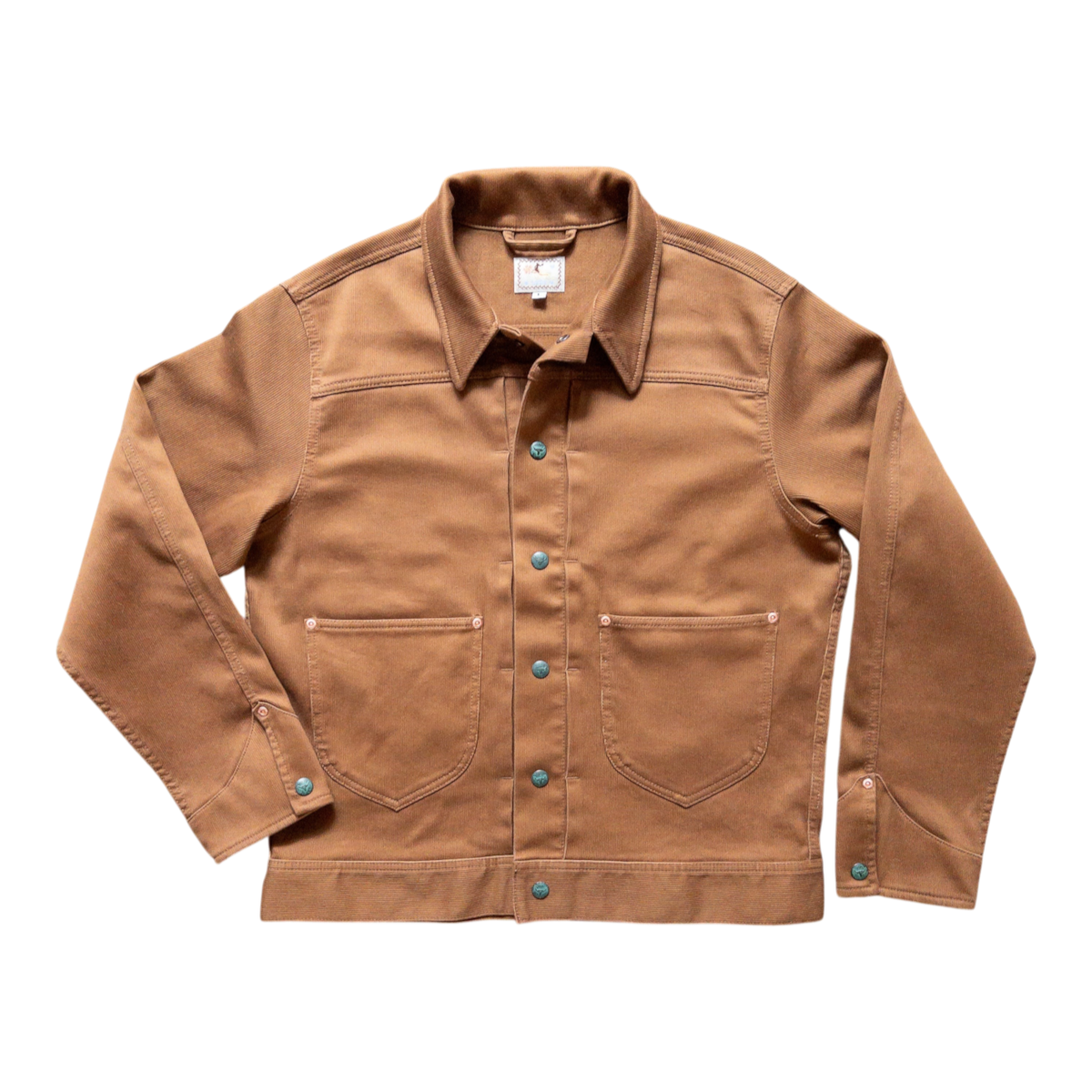 MILWORKS Bedford Cord Ranch Jacket in bay brown with snap front, acorn pockets, and copper rivets on a patterned rug.