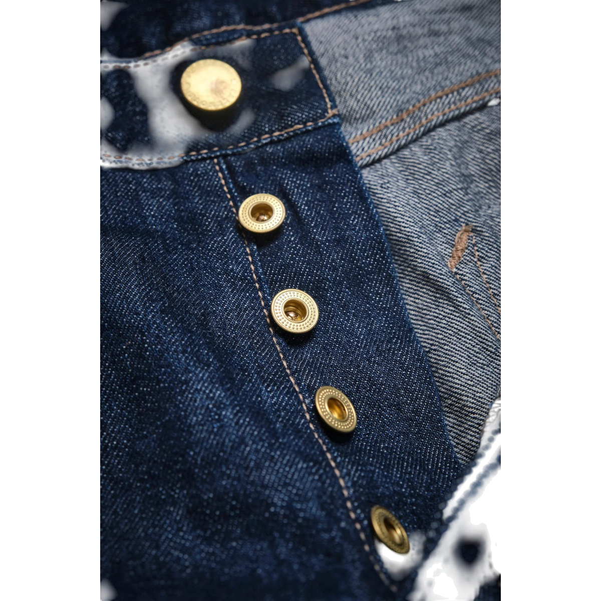 MILWORKS Belford straight fit jeans featuring a button fly with custom brass rivets and deep blue Japanese denim