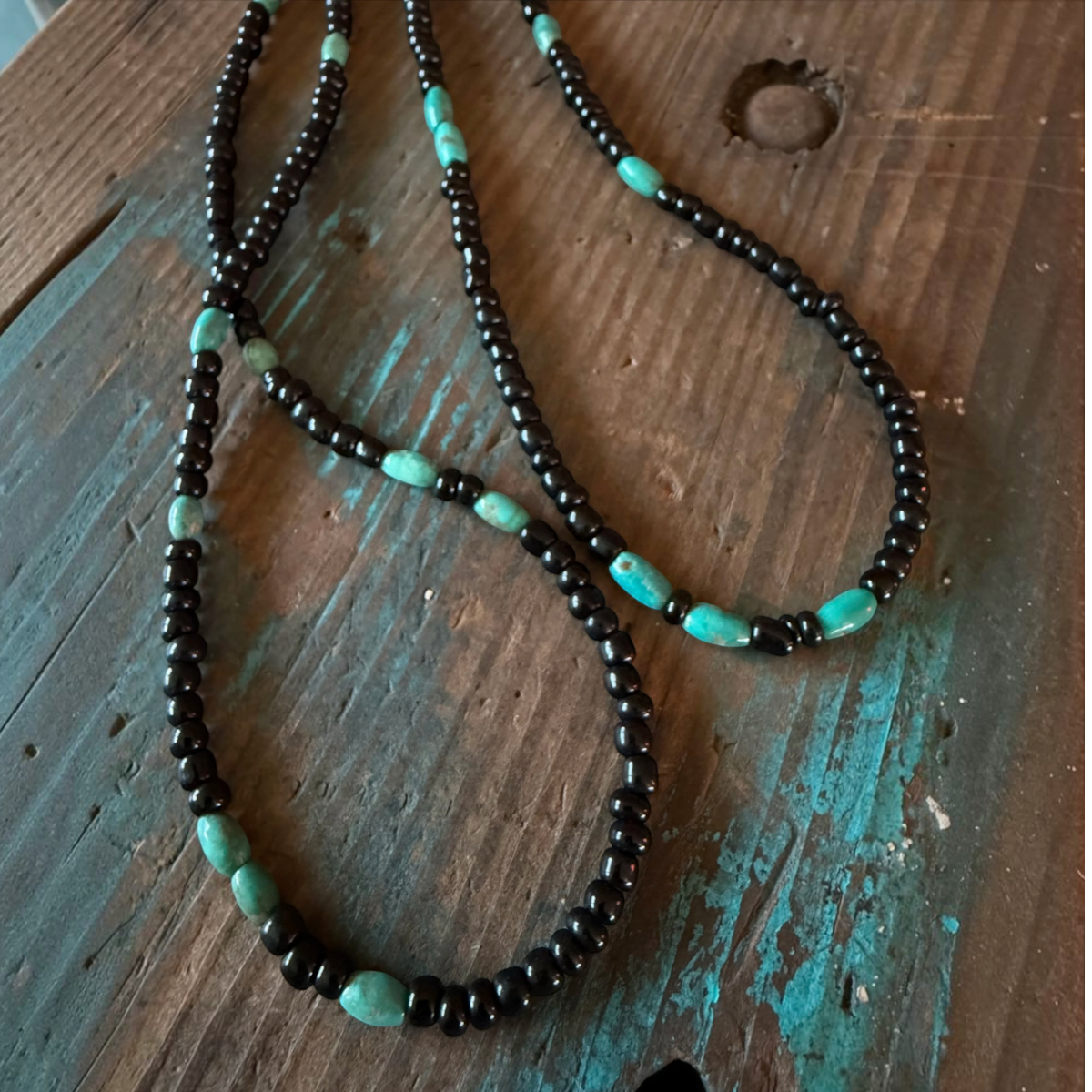 MILWORKS 26-inch necklace featuring black seed beads and genuine turquoise accents on durable flex cord.