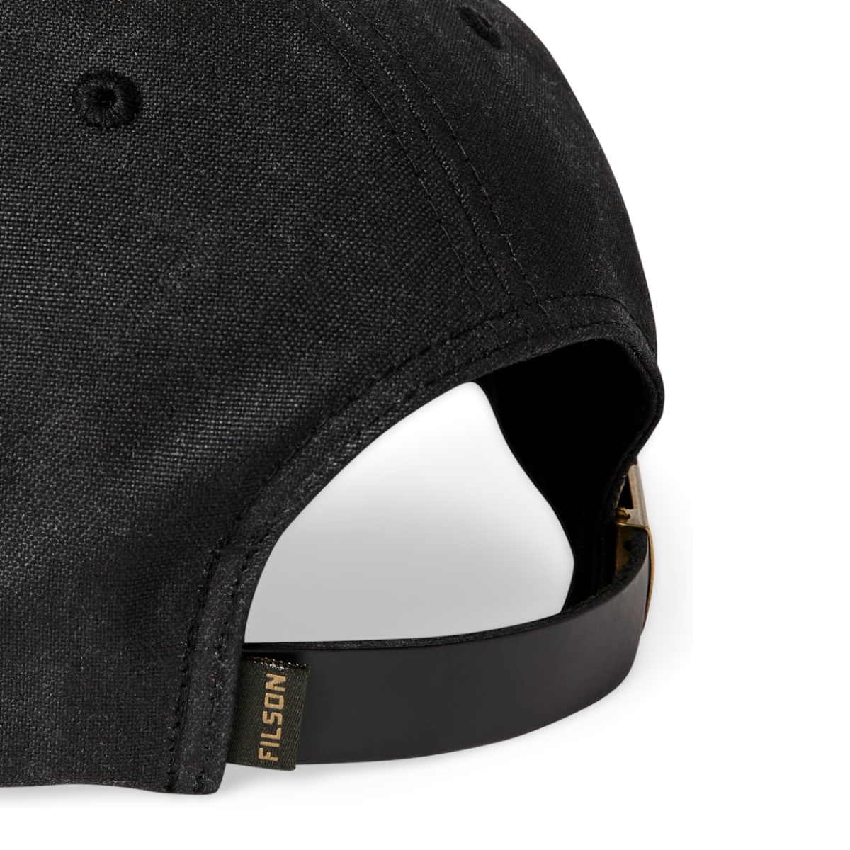 MILWORKS black waxed canvas logger cap featuring a durable leather back strap with a brass buckle and logo tab.
