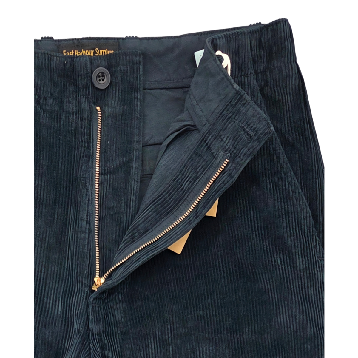 MILWORKS East Harbour Surplus blue corduroy chino trousers featuring a button closure and metal zipper fly.