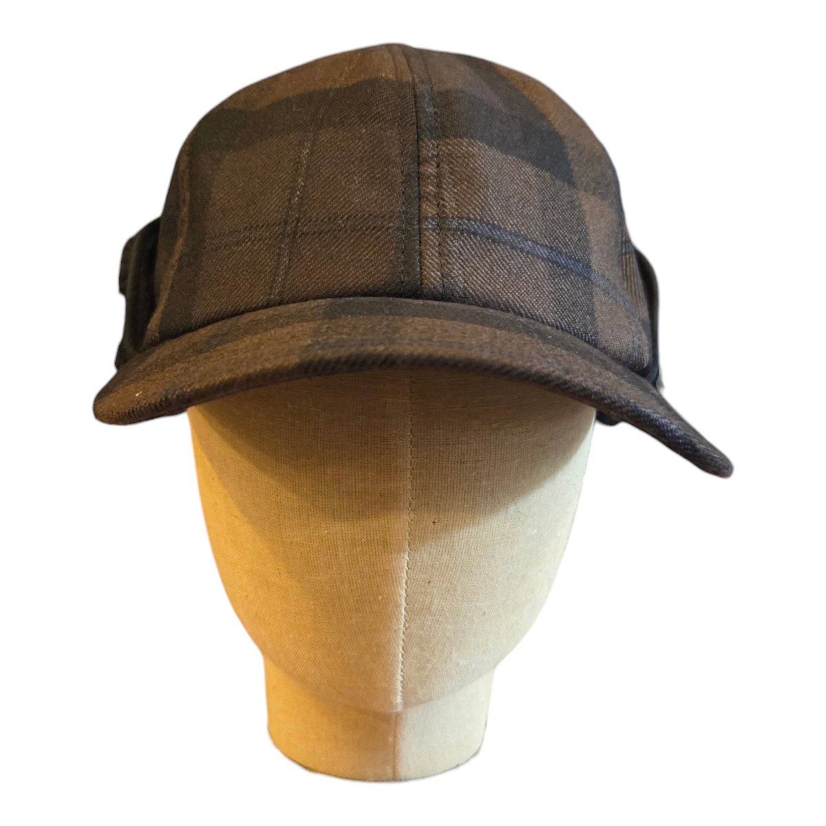MILWORKS EG hunting cap in brown and black worsted wool plaid displayed on a mannequin head