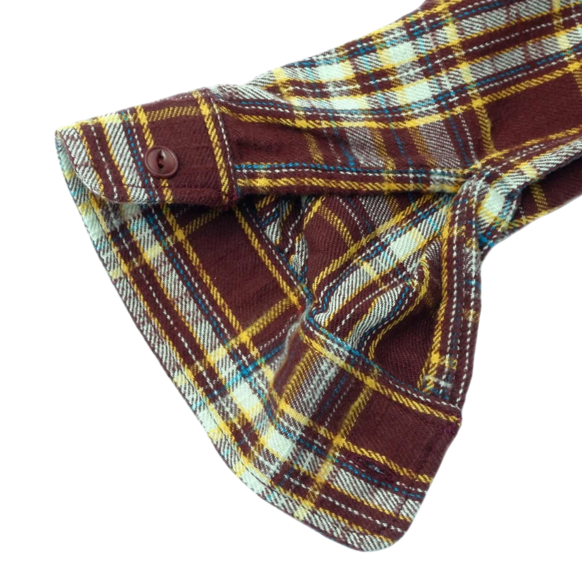 MILWORKS brown slub heavy flannel shirt sleeve cuff with a textured check pattern and a single button closure.