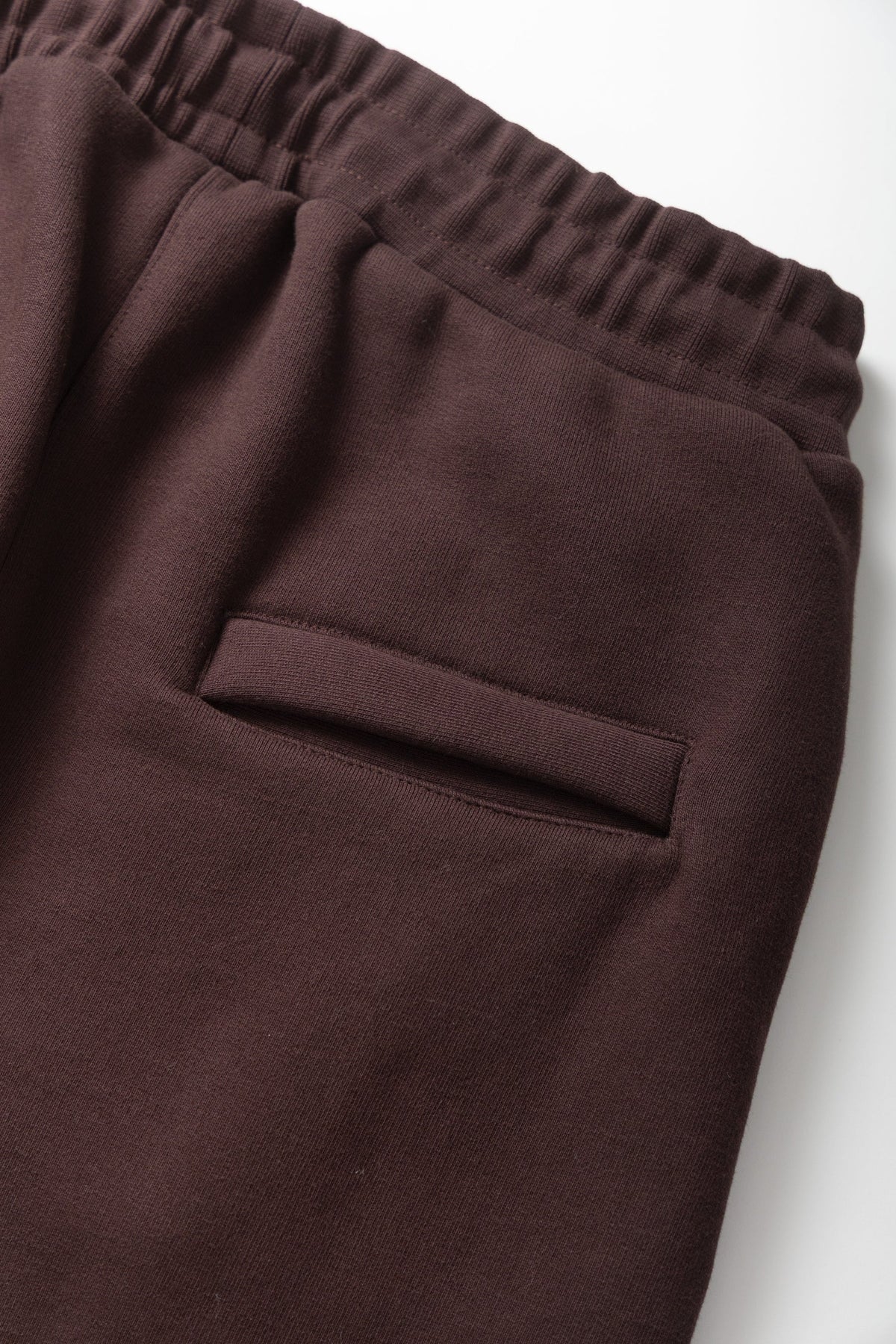 MILWORKS coffee brown 16oz organic cotton heavyweight sweatpants featuring an elastic waistband and side pocket detail.
