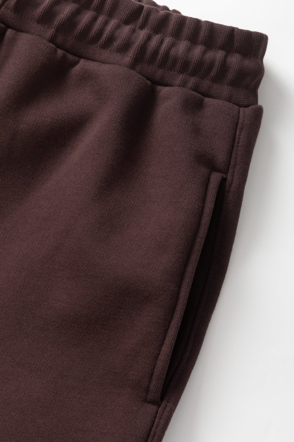 MILWORKS coffee brown 16oz organic cotton heavyweight sweatpants featuring an elastic waistband and side pocket detail.