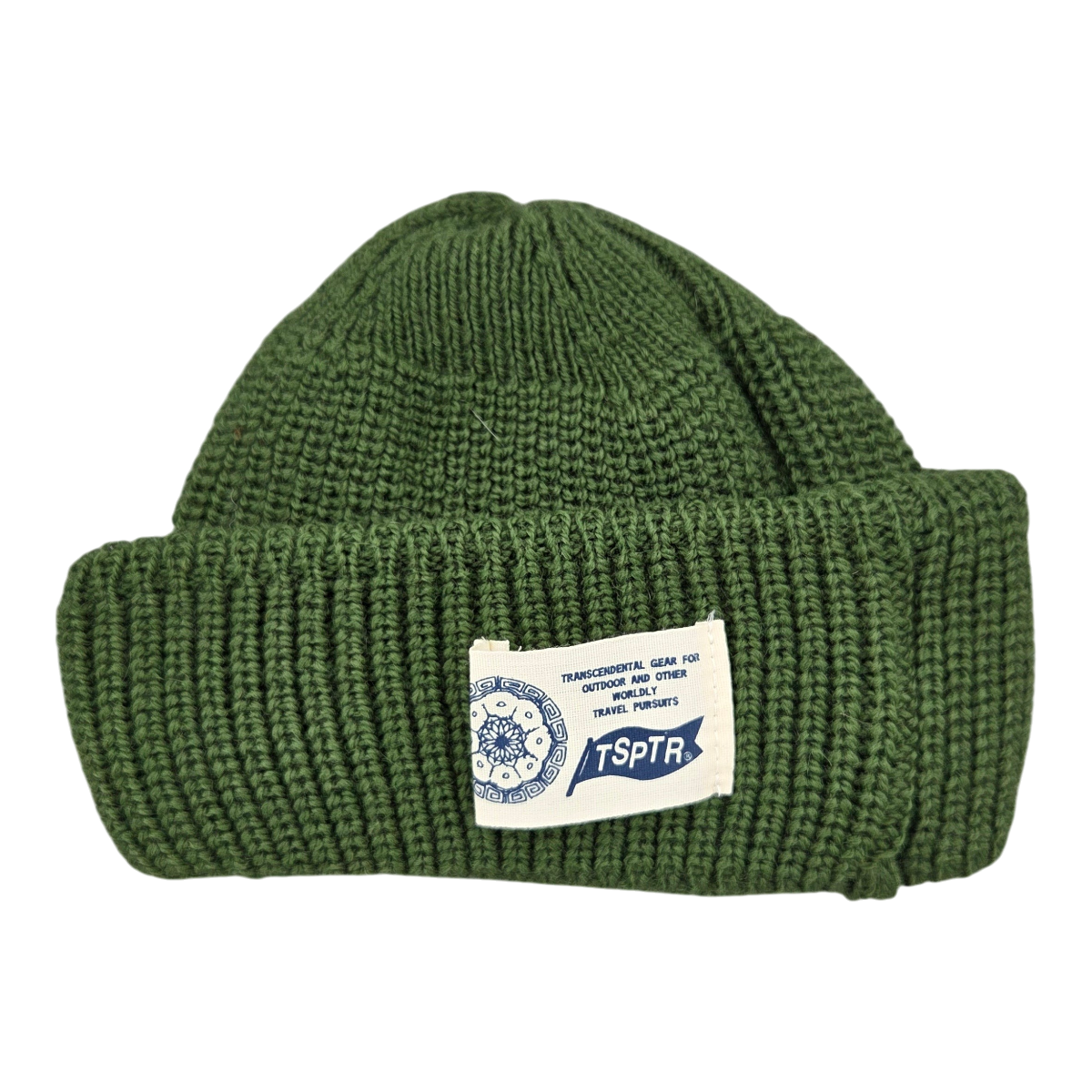 MILWORKS Cosmic Rambler moss green 100% Merino wool knit hat with a chunky folded cuff and TSPTR woven cactus label.
