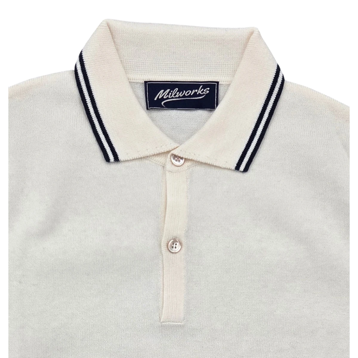 Milworks cream knit cashmere blend polo shirt with navy striped collar and two button placket.