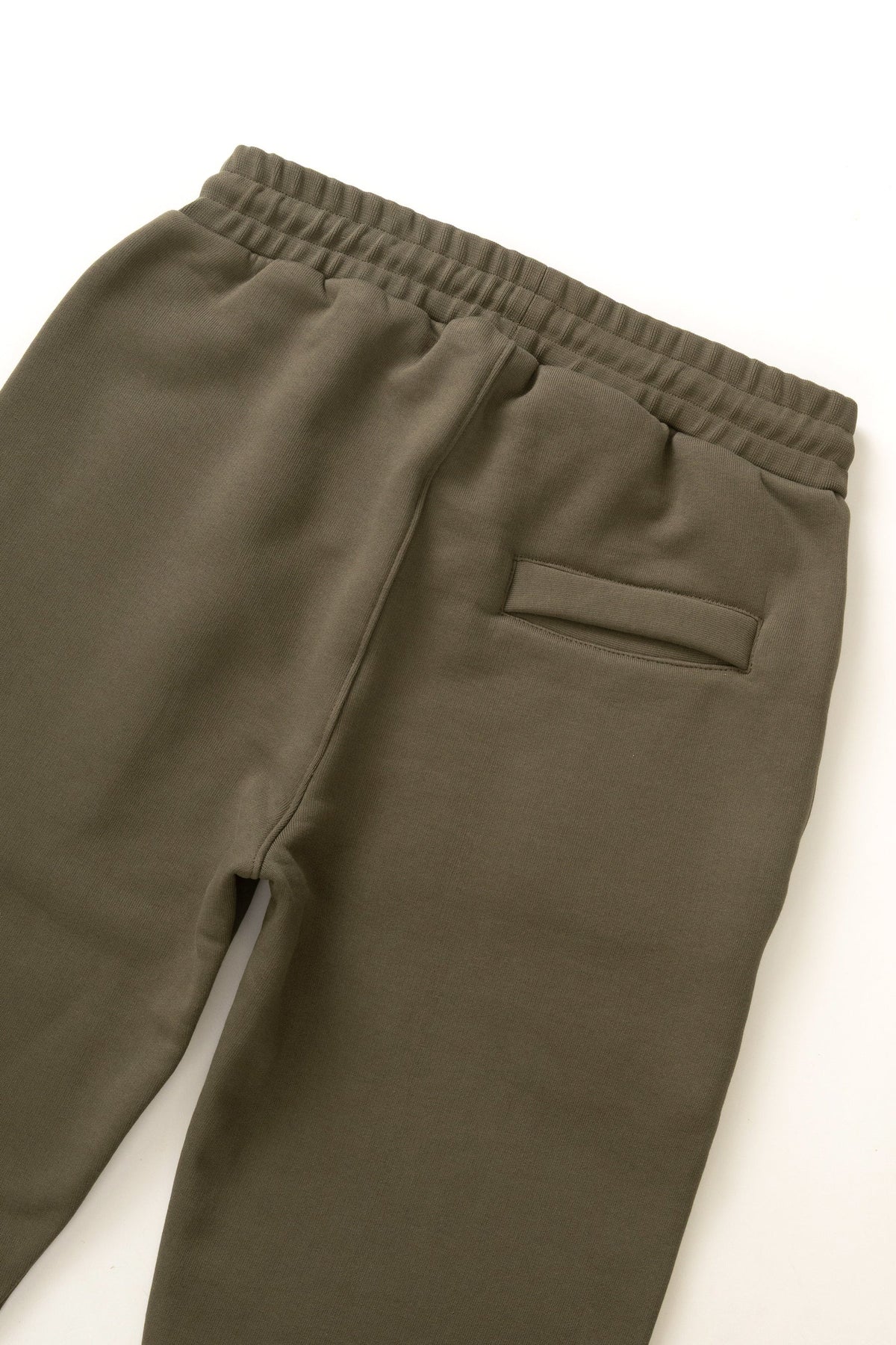 MILWORKS dark olive 16oz organic cotton heavyweight sweatpants featuring an elastic waistband and back pocket detail.