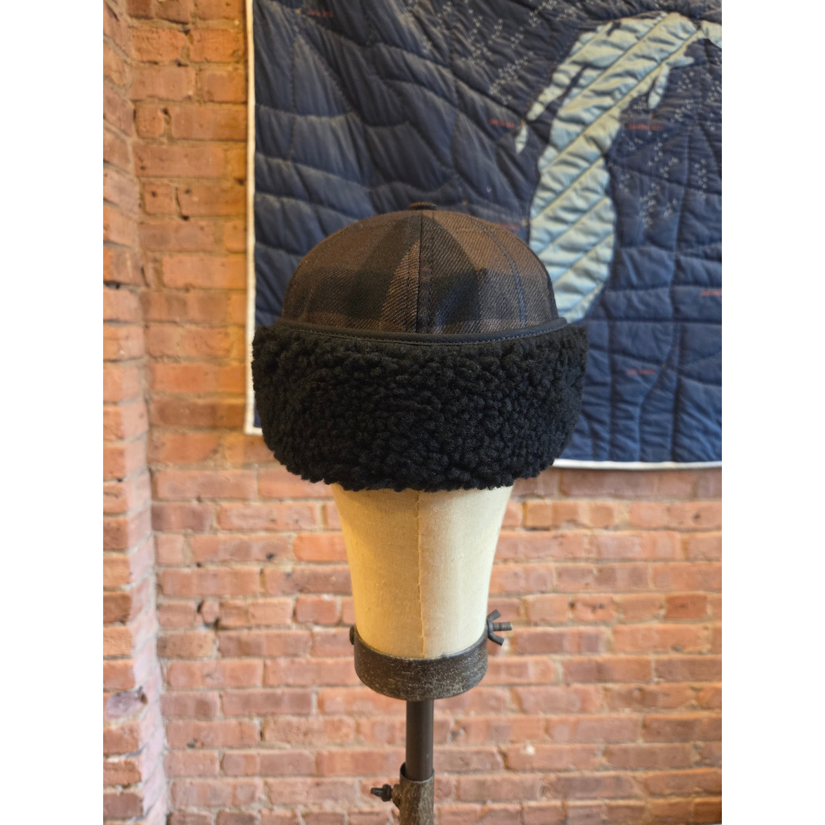 MILWORKS EG hunting cap in brown and black worsted wool plaid with a textured black shearling-style brim