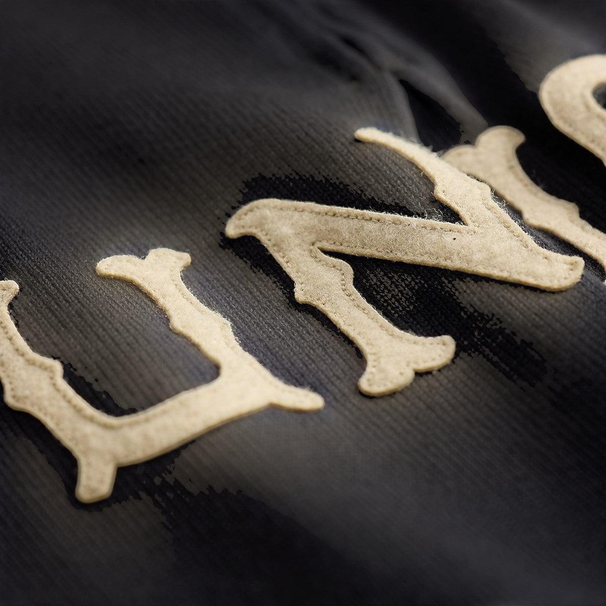 MILWORKS faded navy cotton-blend fleece half zip sweatshirt with textured cream-colored lettering detail