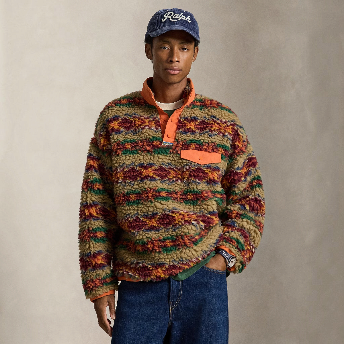 MILWORKS model wearing a relaxed fit high-pile fleece pullover with a red rock Fair Isle print and snap placket.