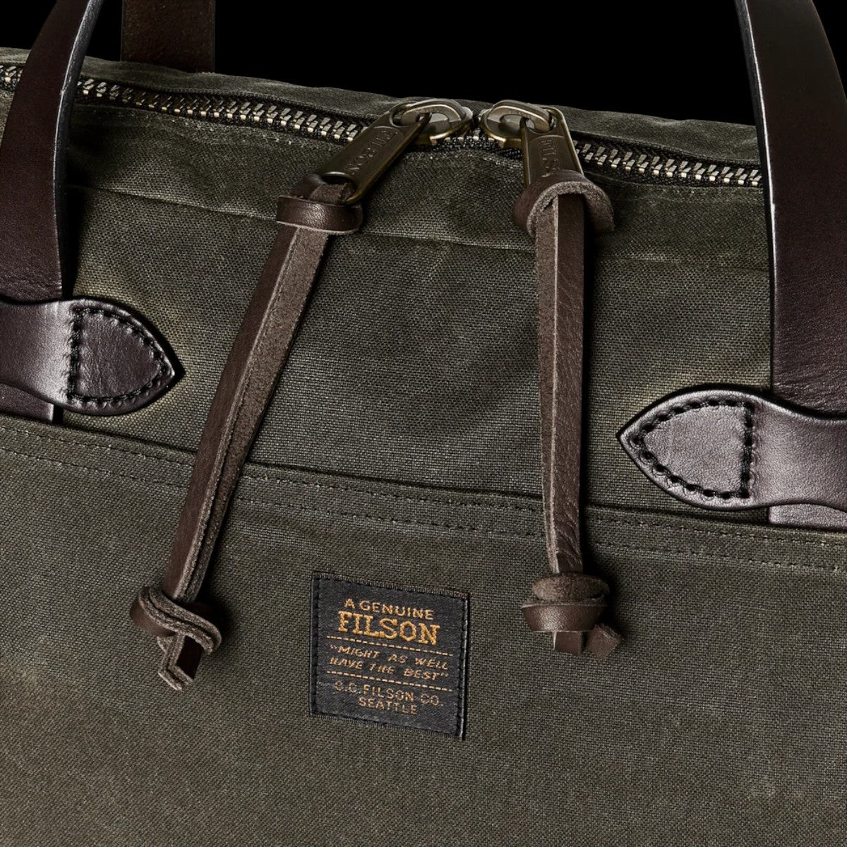 MILWORKS Filson Tin Cloth compact briefcase in otter green with leather handles and metal zipper detail