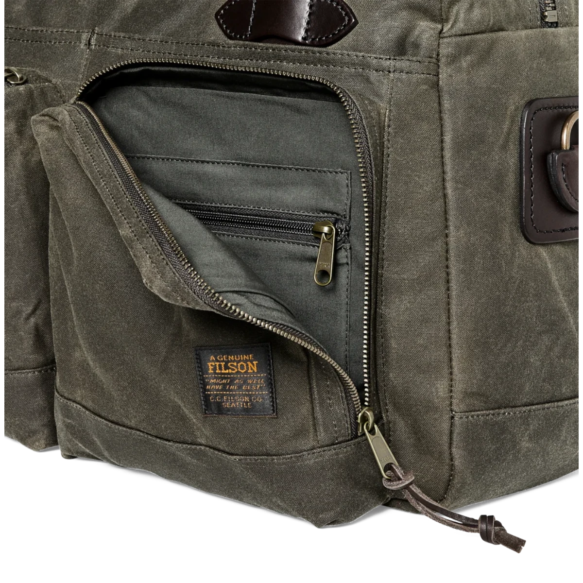 MILWORKS Filson 48-Hour Tin Cloth Duffle in Otter Green featuring a zippered front pocket and leather accents